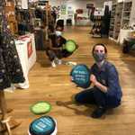 Stay safe out there! Here are some volunteers at the @chifairtrade pop-up shop applying our social distancing floor decals: a set of a dozen, all with different fair trade facts. Way more fun and informative than off-the-shelf options! Check out how cute they are in person in Lincoln Park or browse away from home (or work, shh!) at chiagofairtradepopupshop.org